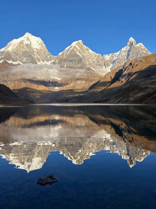 Huayhuash peaks reflected in a mountain lake
